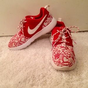 Red and white Nike tennis shoes
